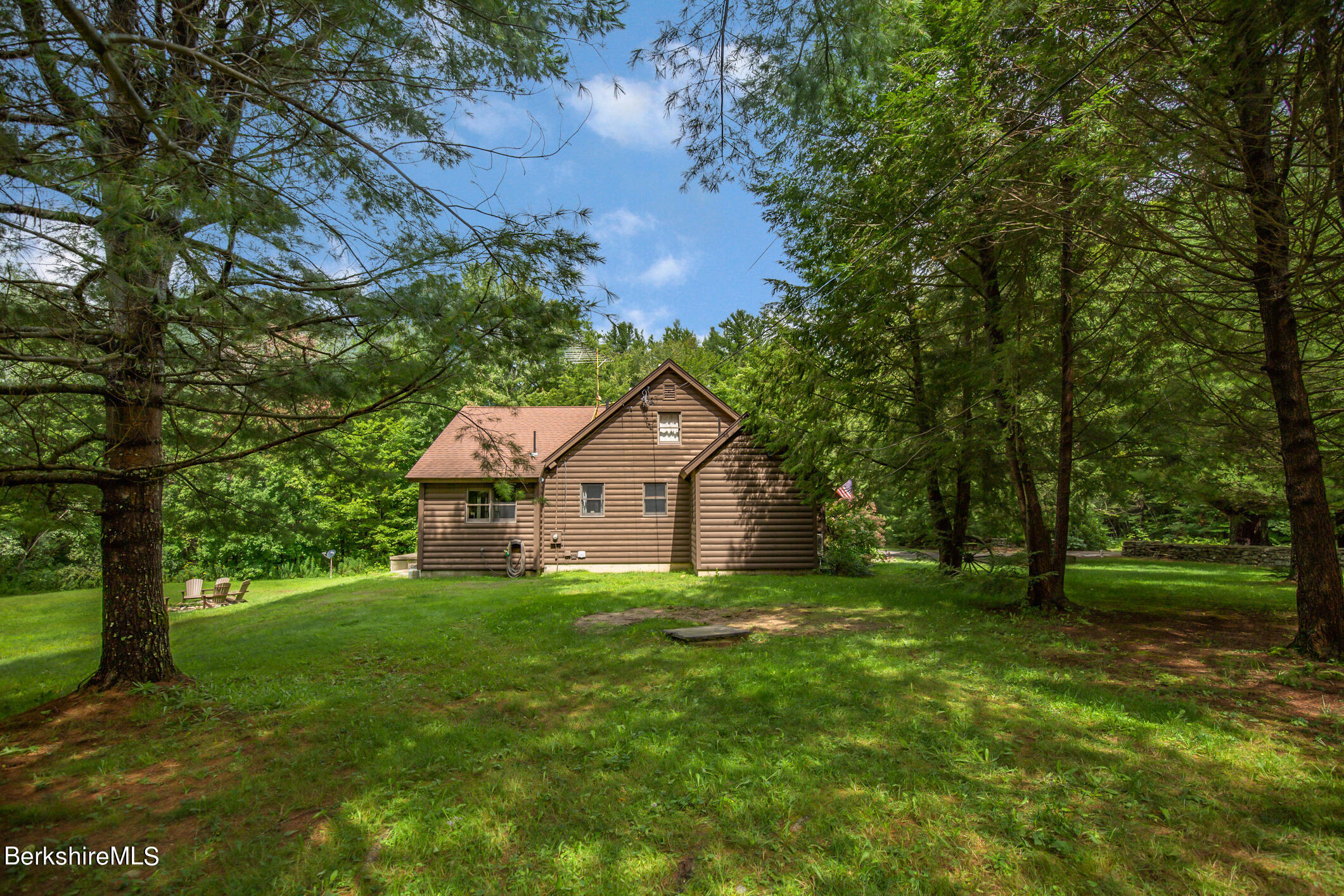 43 Becket Road Otis, MA 01029 - Photo 33 of 41 a house view with a garden