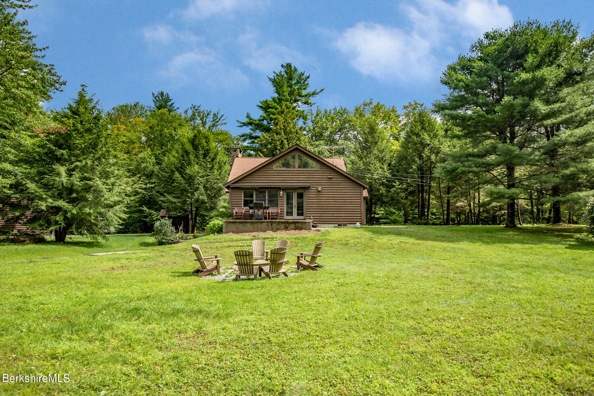 43 Becket Road Otis, MA 01029 - Photo 36 of 41 a front view of a house with a yard