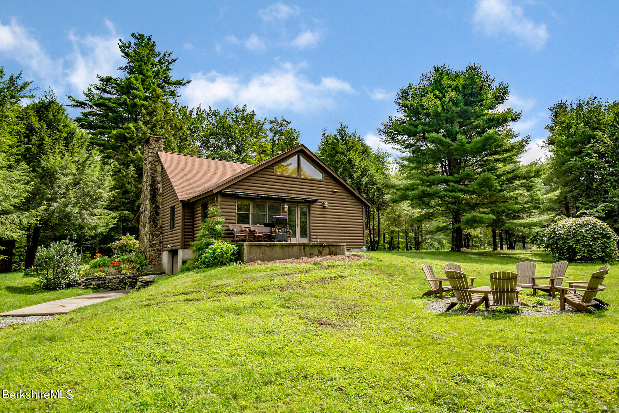 43 Becket Road Otis, MA 01029 - Photo 37 of 41 a view of a house with garden and sitting area