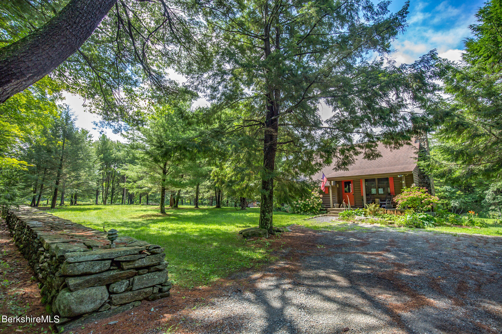 43 Becket Road Otis, MA 01029 - Photo 41 of 41 a view of a house with a yard