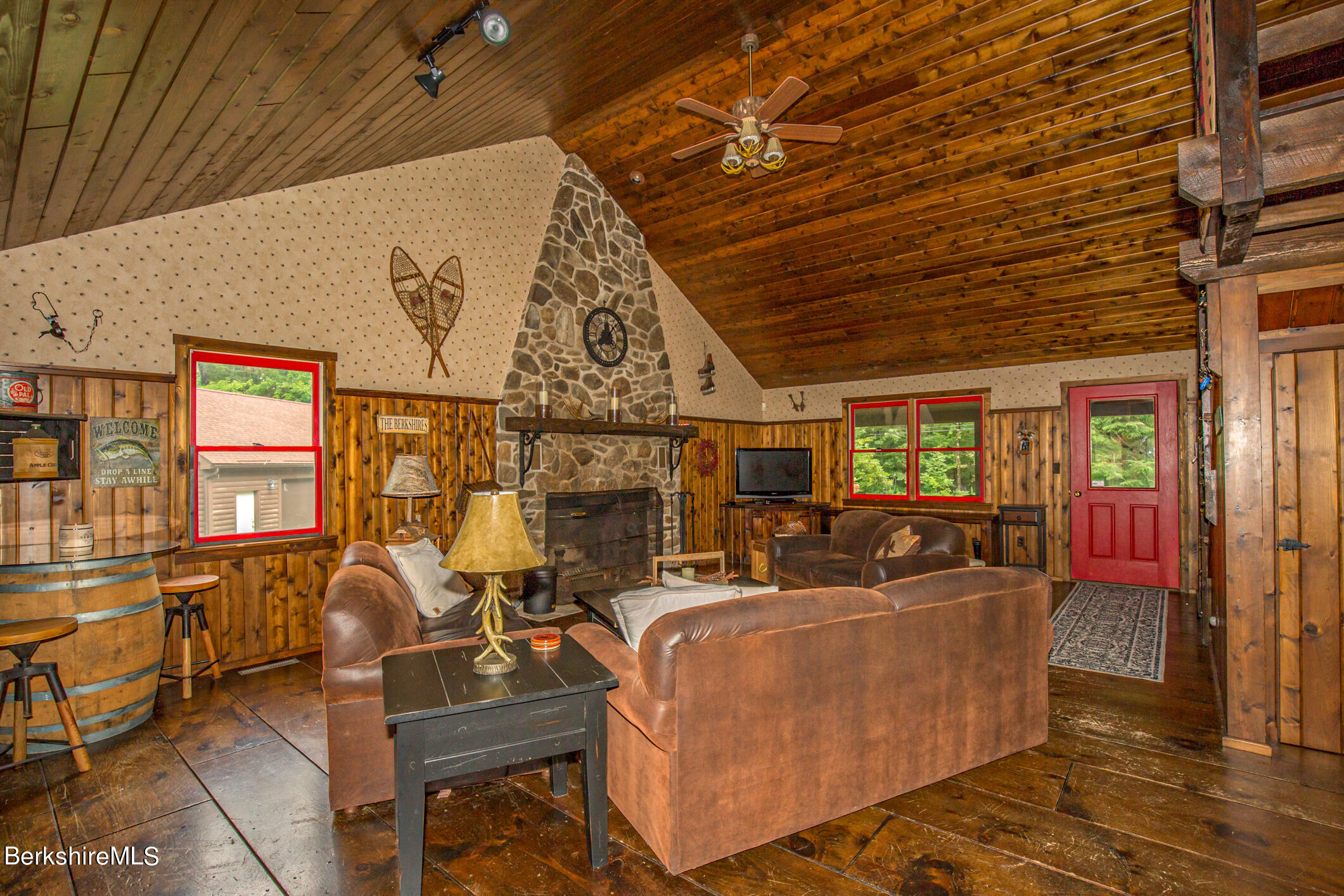 43 Becket Road Otis, MA 01029 - Photo 6 of 41 a living room with fireplace furniture and a wooden floor