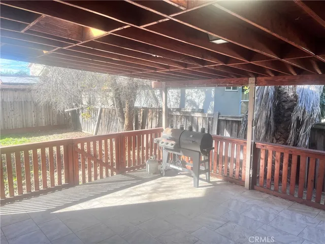 a view of porch with wooden floor