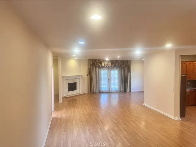 a view of an empty room with a closet