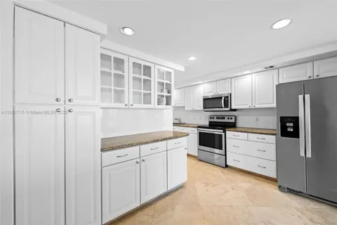 a view of a kitchen with a sink