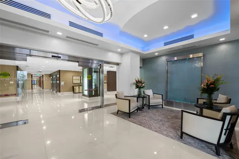 a room with pool table and windows