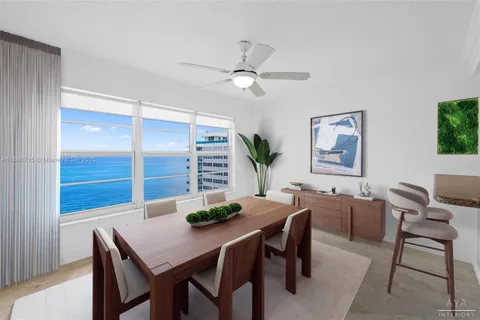 a view of a dining room with furniture and window