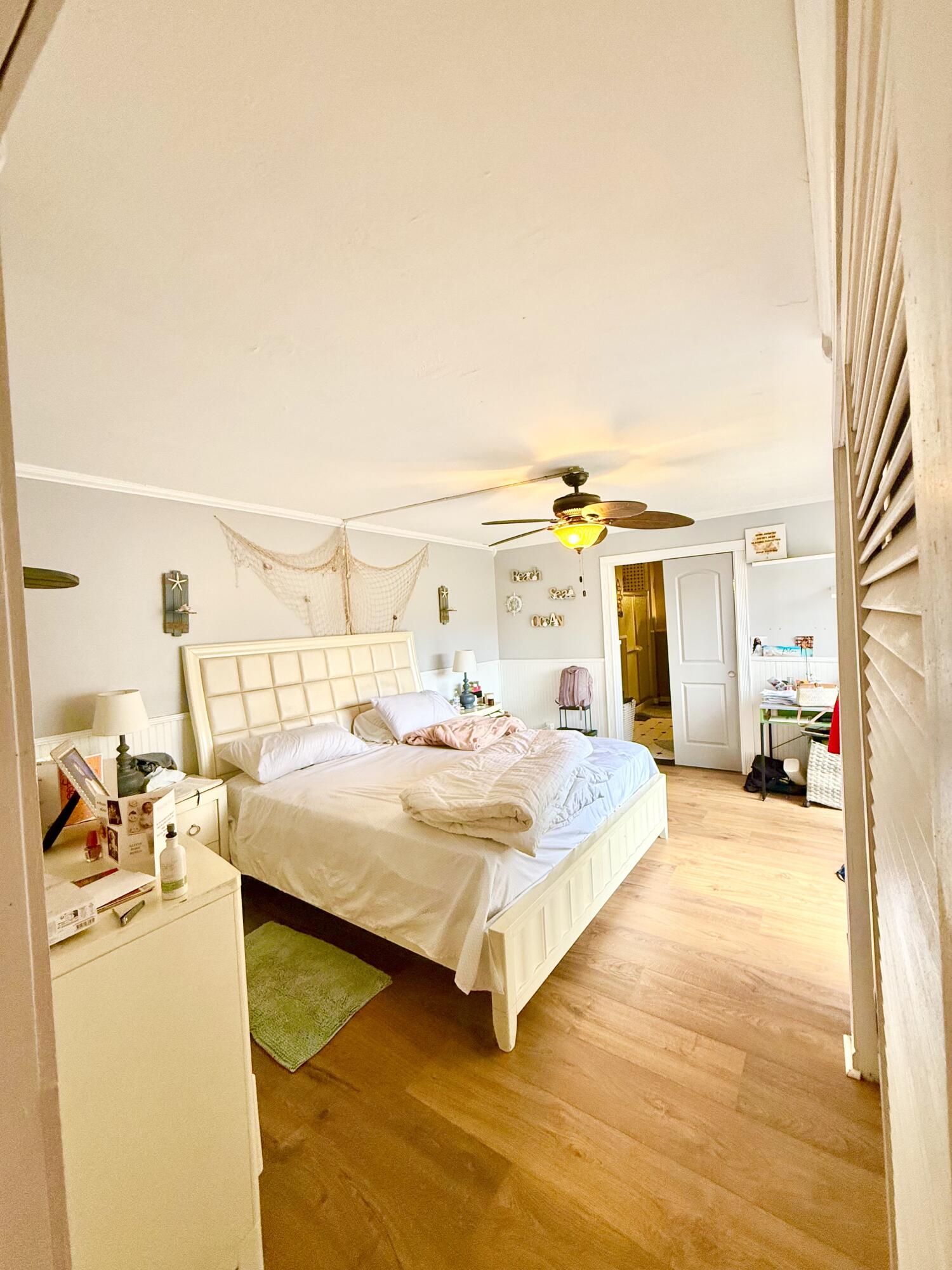 711 Springdale Circle Palm Springs, FL 33461 - Photo 11 of 11 a bedroom with a bed and a night stand