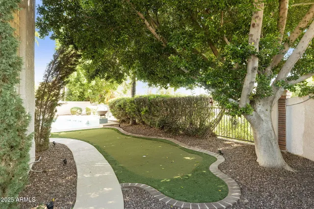 a kitchen with white cabinets appliances and sink