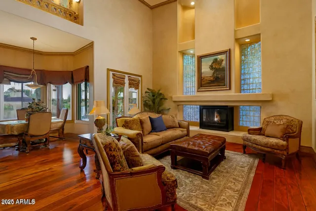 a spacious bathroom with a double vanity sink a large mirror and a shower