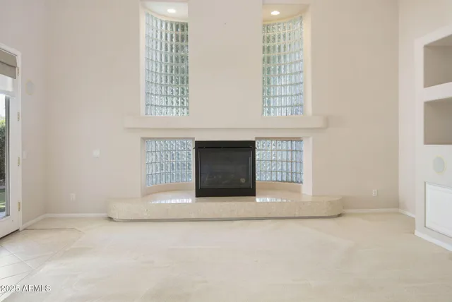 a view of an empty room with white walls