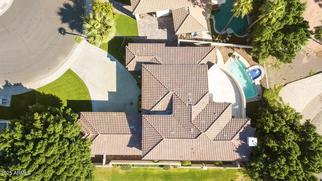 a view of a house with backyard porch and sitting area