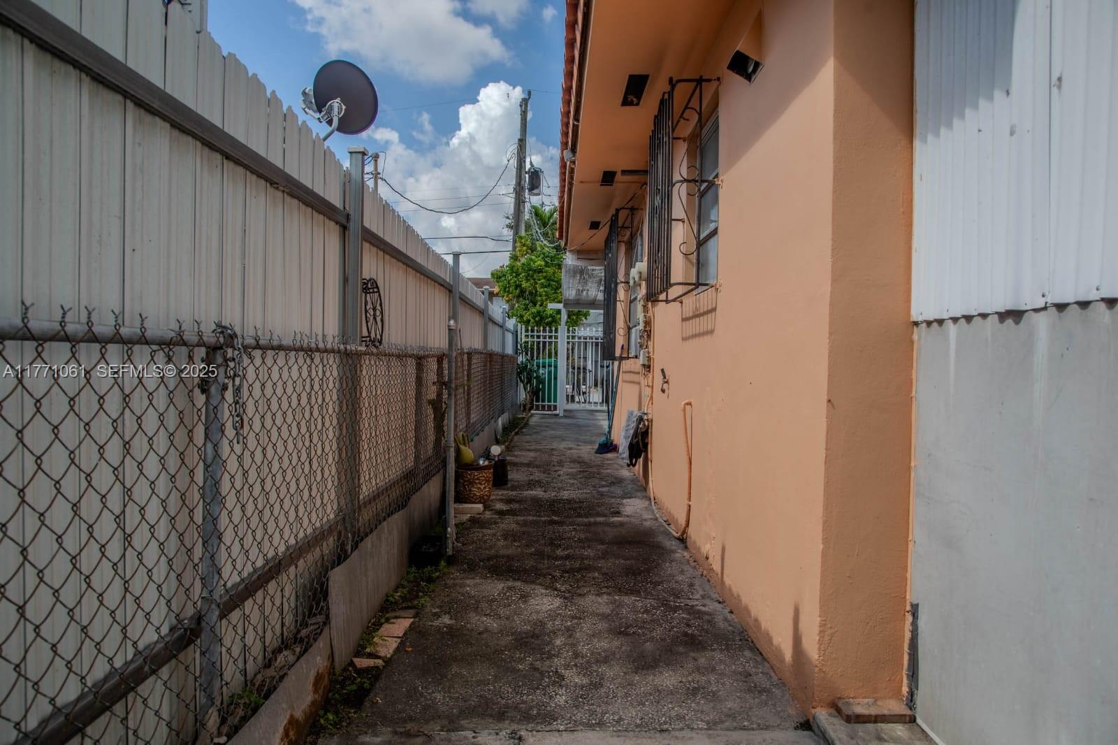 791 Northwest 22nd Place Miami, FL 33125 - Photo 11 of 33 a view of staircase with wooden floor and stairs