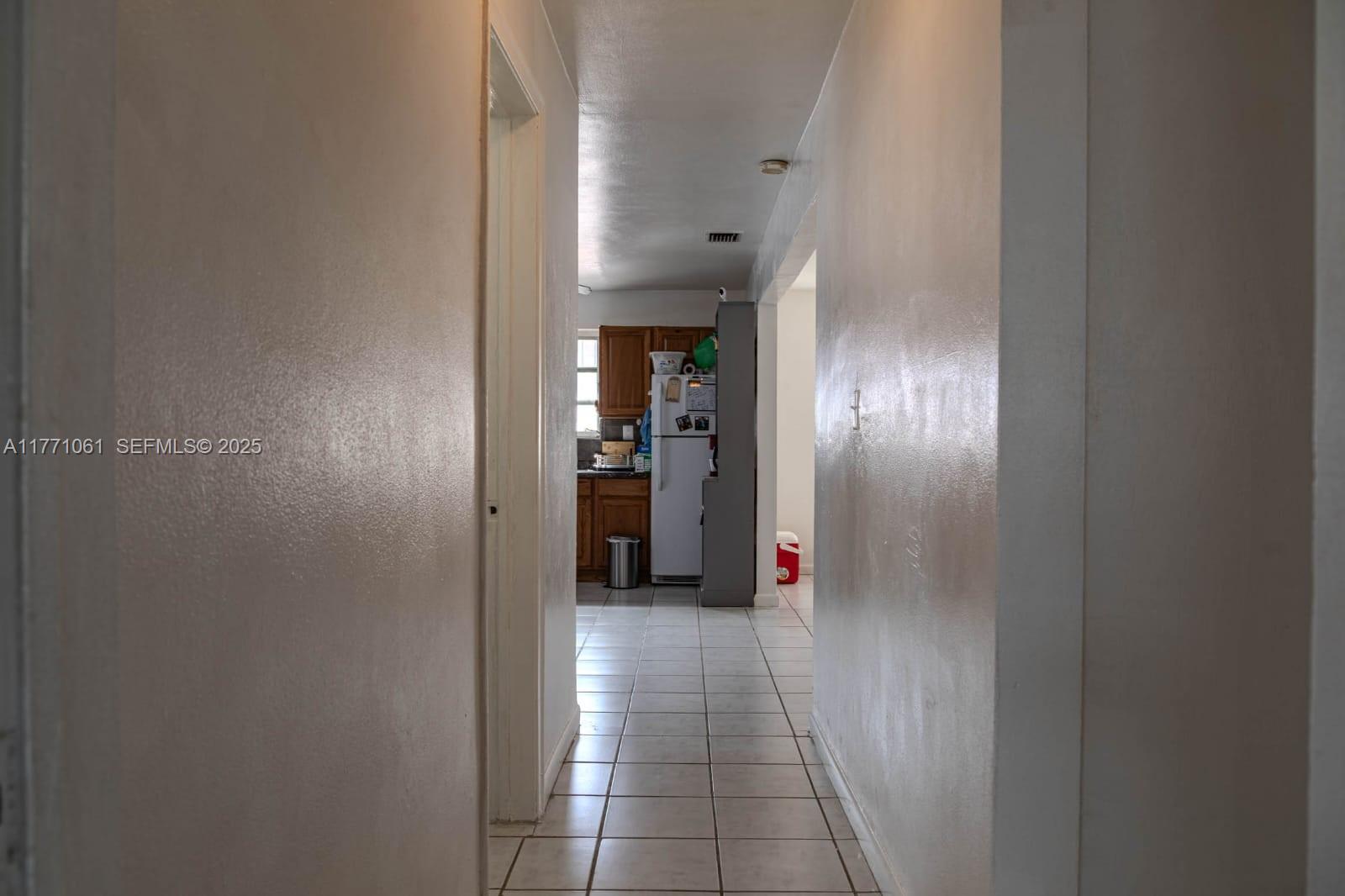 791 Northwest 22nd Place Miami, FL 33125 - Photo 23 of 33 a view of a hallway with wooden floor