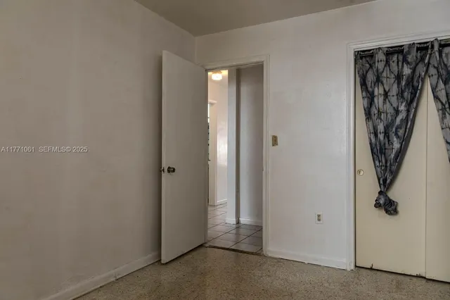 a view of a hallway with closet area
