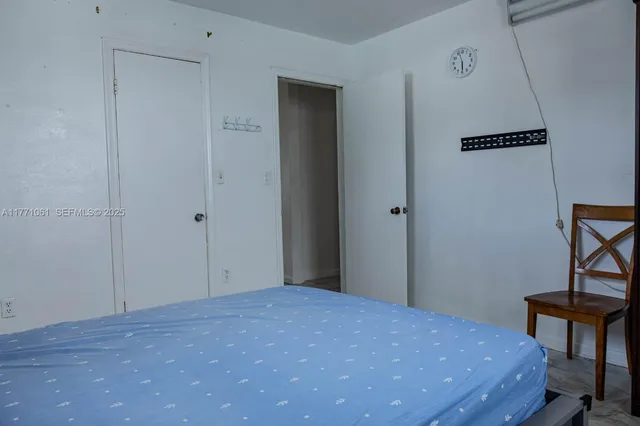 a bedroom with a bed and a table in it