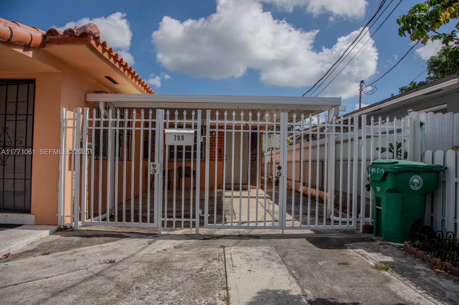 791 Northwest 22nd Place Miami, FL 33125 - Photo 5 of 33 a view of a front door and a mirror