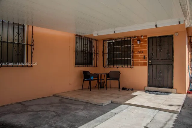 a view of a livingroom with furniture and window