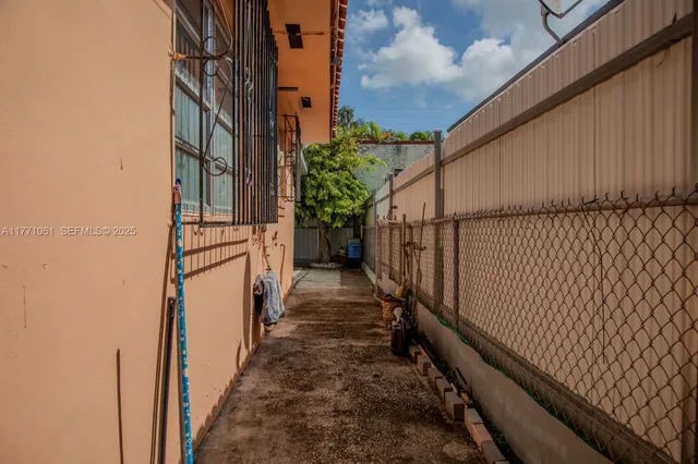 a view of a pathway of a building from a balcony