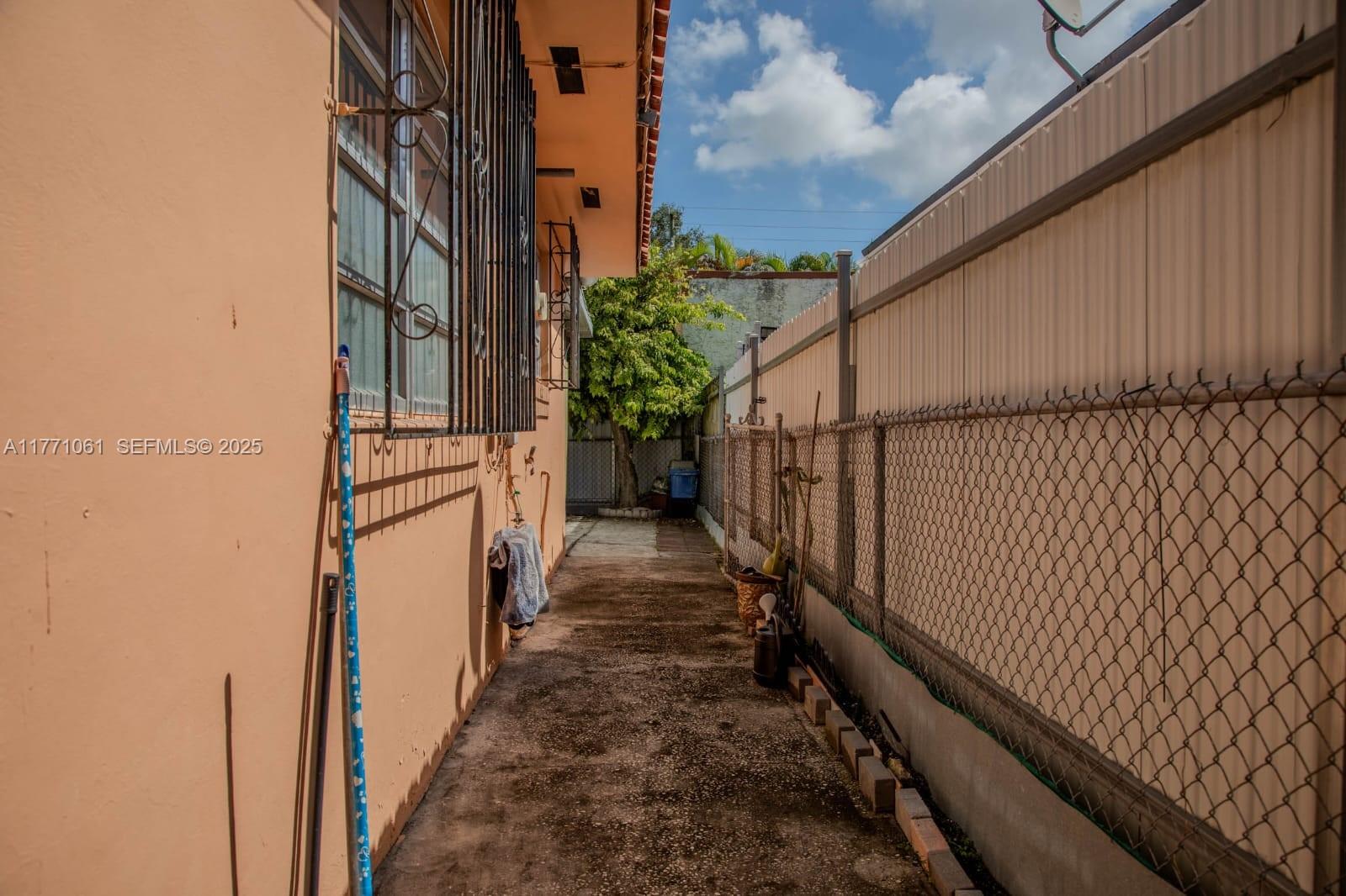791 Northwest 22nd Place Miami, FL 33125 - Photo 10 of 33 a view of a pathway of a building from a balcony