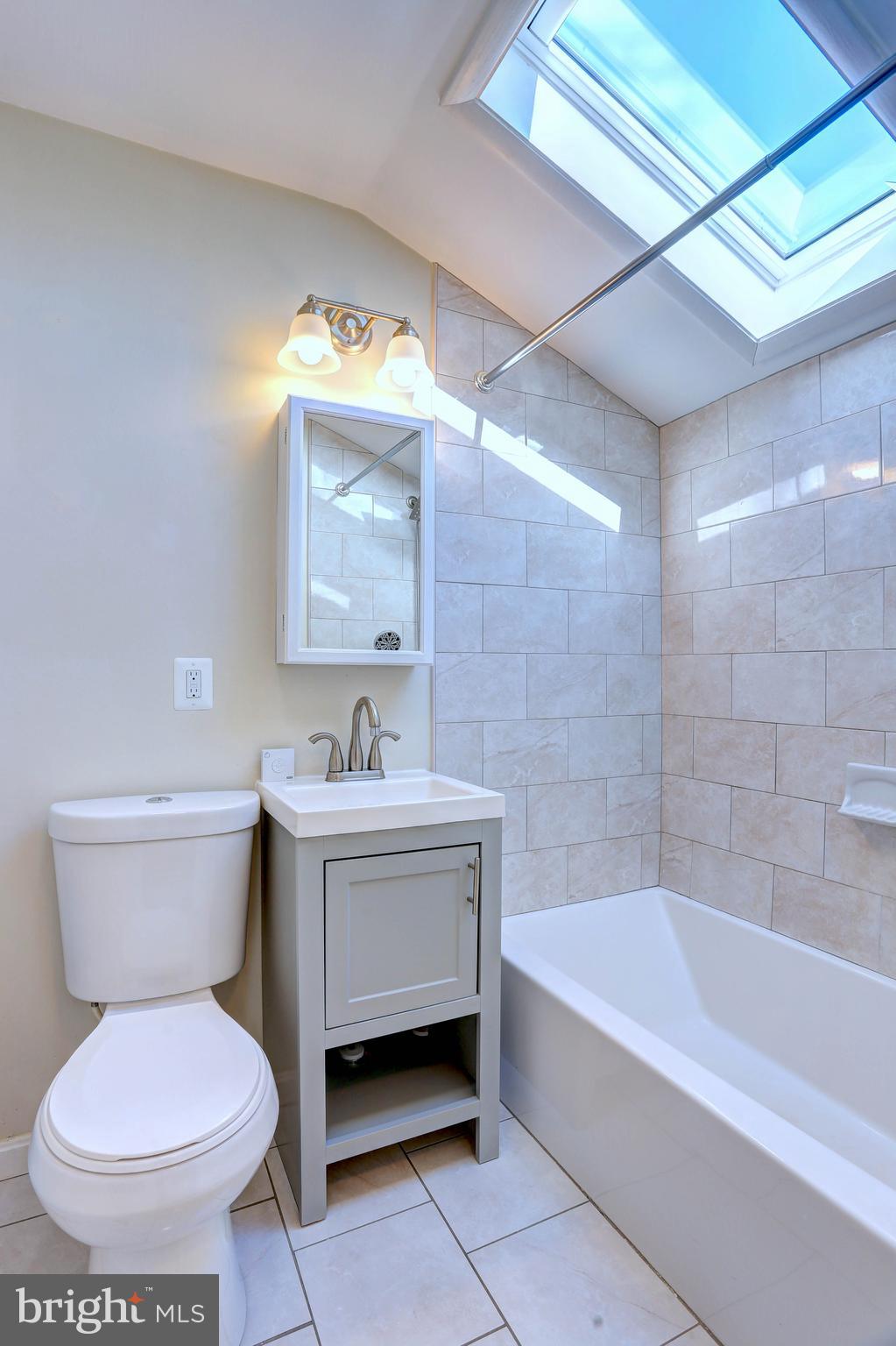 1222 Locust Avenue Halethorpe, MD 21227 - Photo 18 of 34 a bathroom with a sink toilet and bathtub