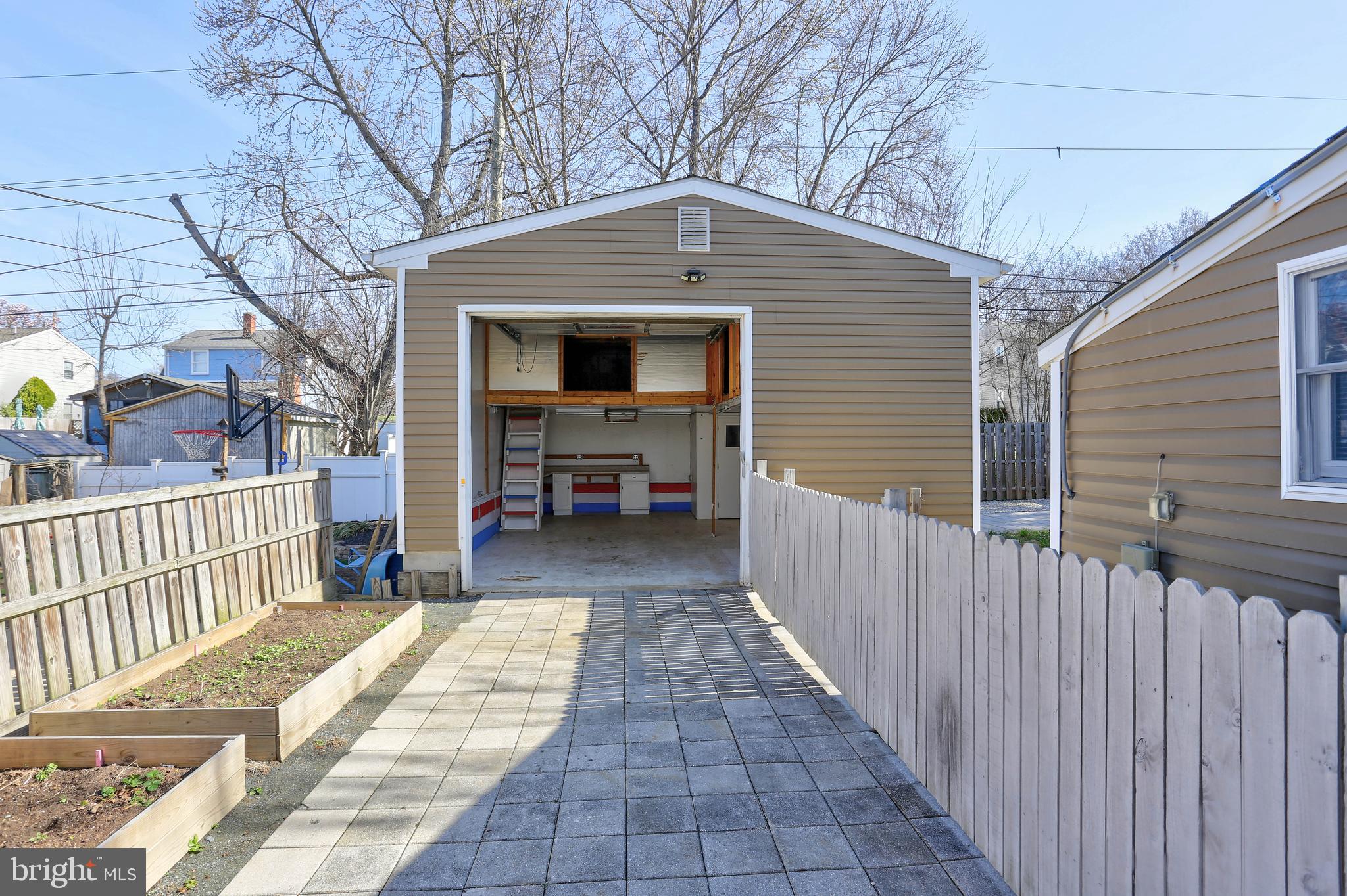 1222 Locust Avenue Halethorpe, MD 21227 - Photo 21 of 34 a view of a house with a small yard and wooden fence
