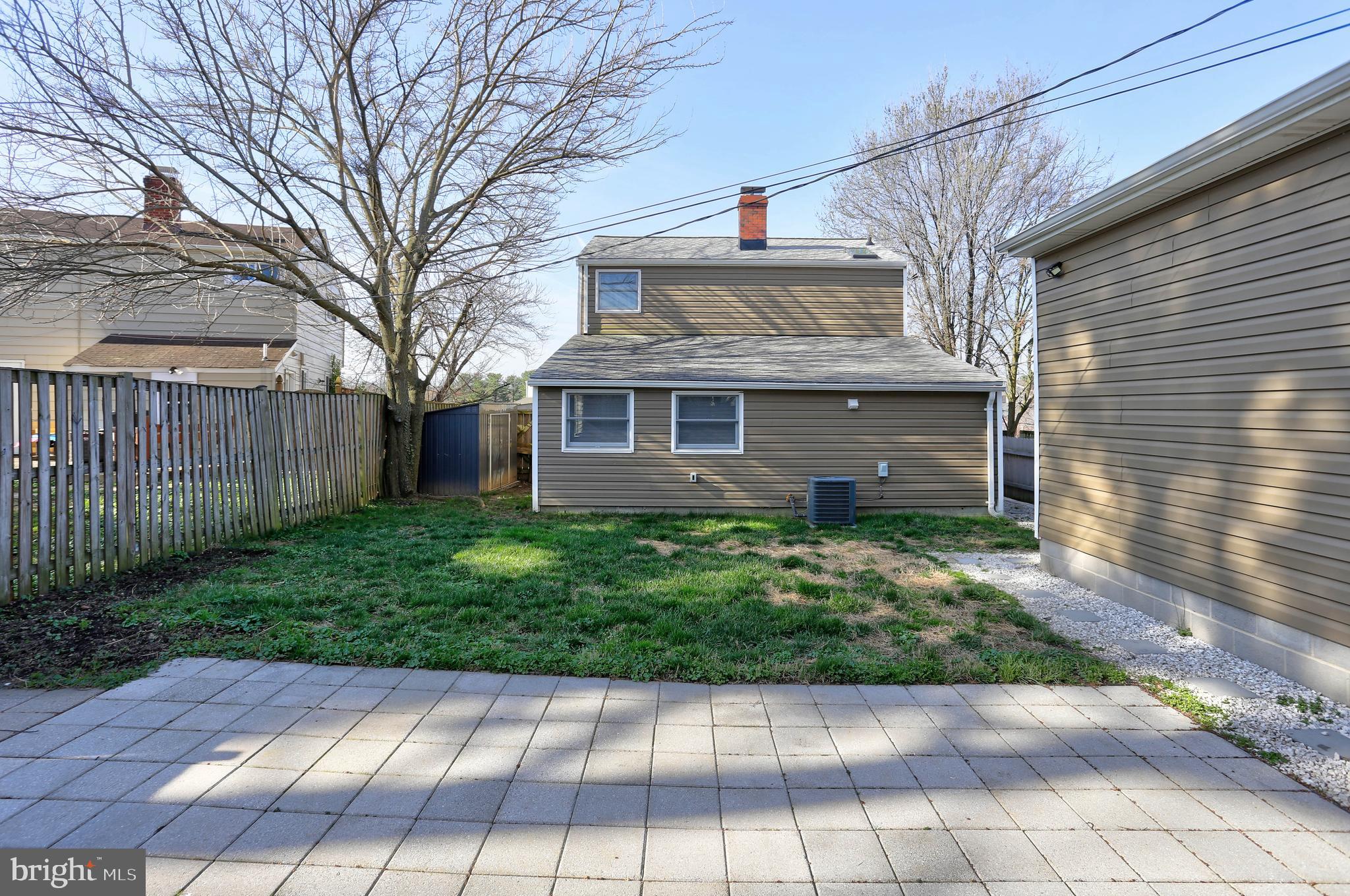 1222 Locust Avenue Halethorpe, MD 21227 - Photo 25 of 34 a view of a brick house with a yard