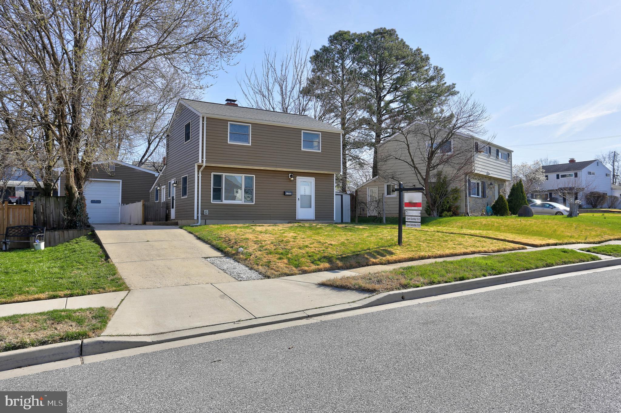 1222 Locust Avenue Halethorpe, MD 21227 - Photo 28 of 34 a view of a house with a big yard and large trees
