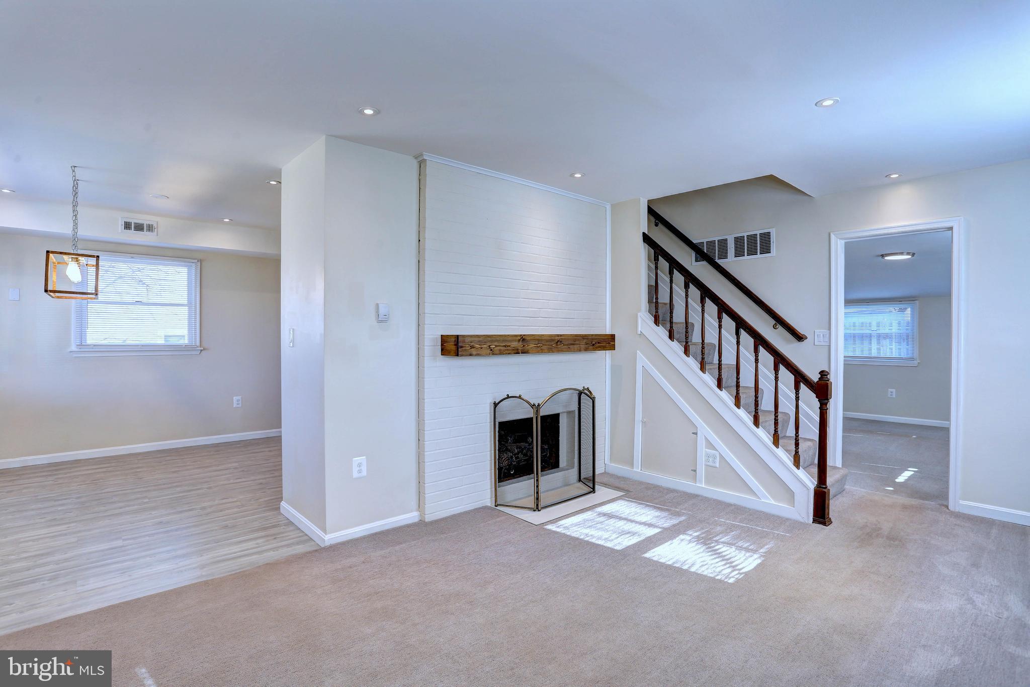 1222 Locust Avenue Halethorpe, MD 21227 - Photo 3 of 34 an entryway in a hall with a fireplace and a window
