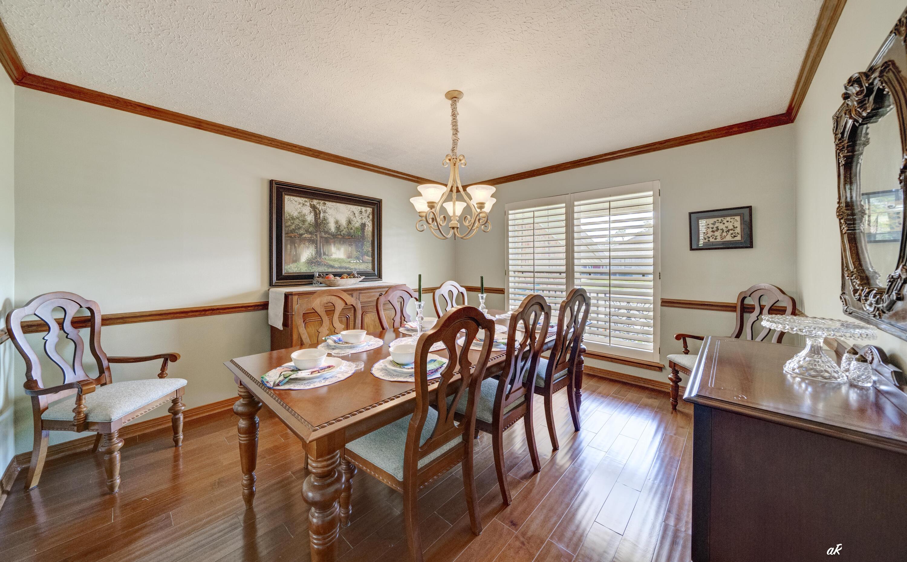 2910 Kings Harbour Road Panama City, FL 32405 - Photo 15 of 50 a view of a a dining room with furniture window and wooden floor