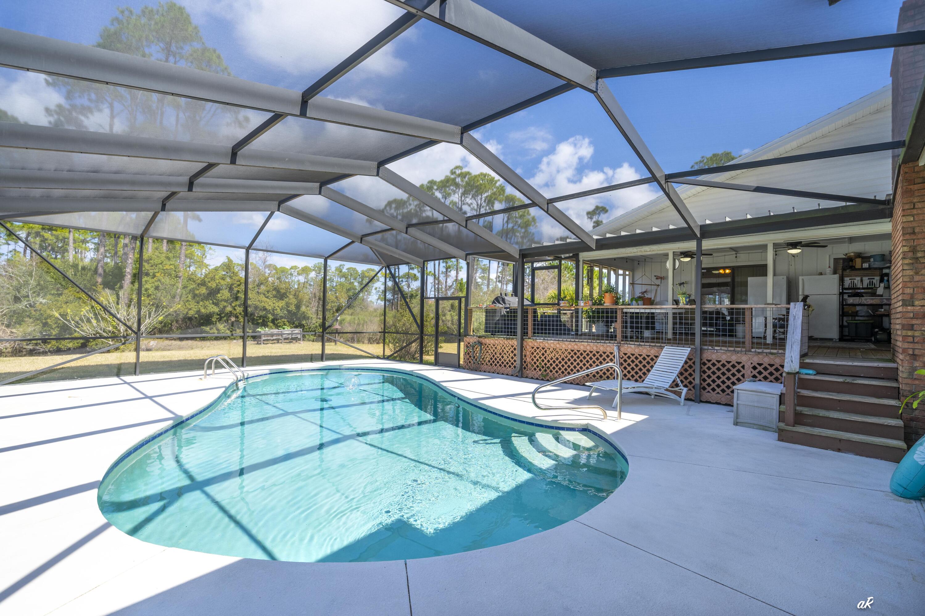 2910 Kings Harbour Road Panama City, FL 32405 - Photo 2 of 50 a view of a swimming pool with a patio