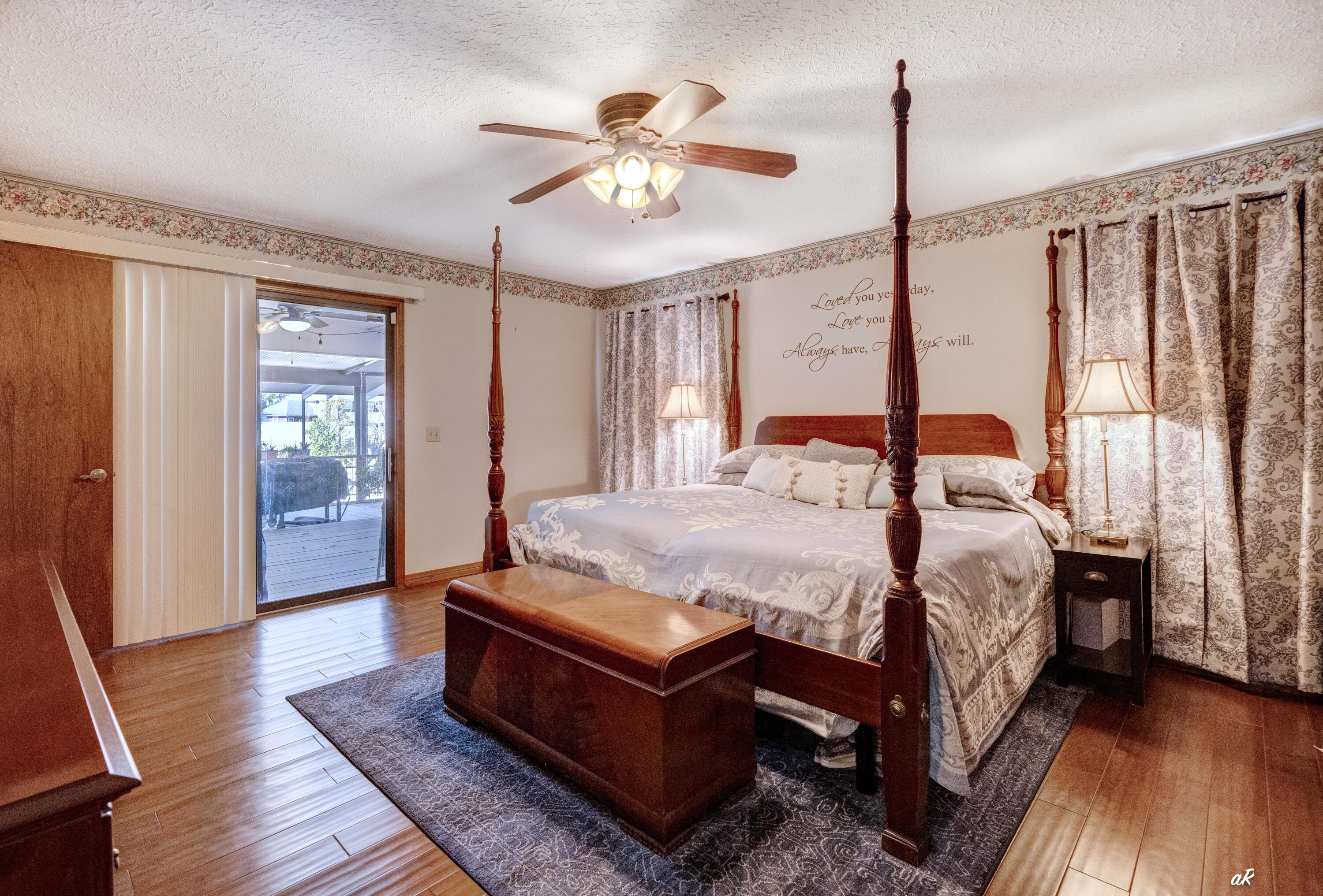 2910 Kings Harbour Road Panama City, FL 32405 - Photo 24 of 50 a bed sitting in a spacious bedroom next to a window