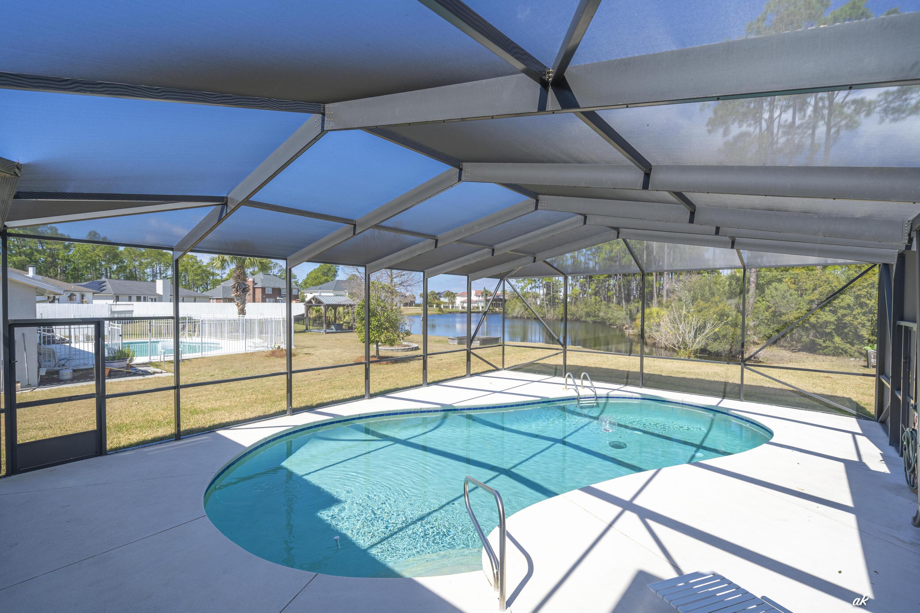 2910 Kings Harbour Road Panama City, FL 32405 - Photo 34 of 50 a room with pool and windows