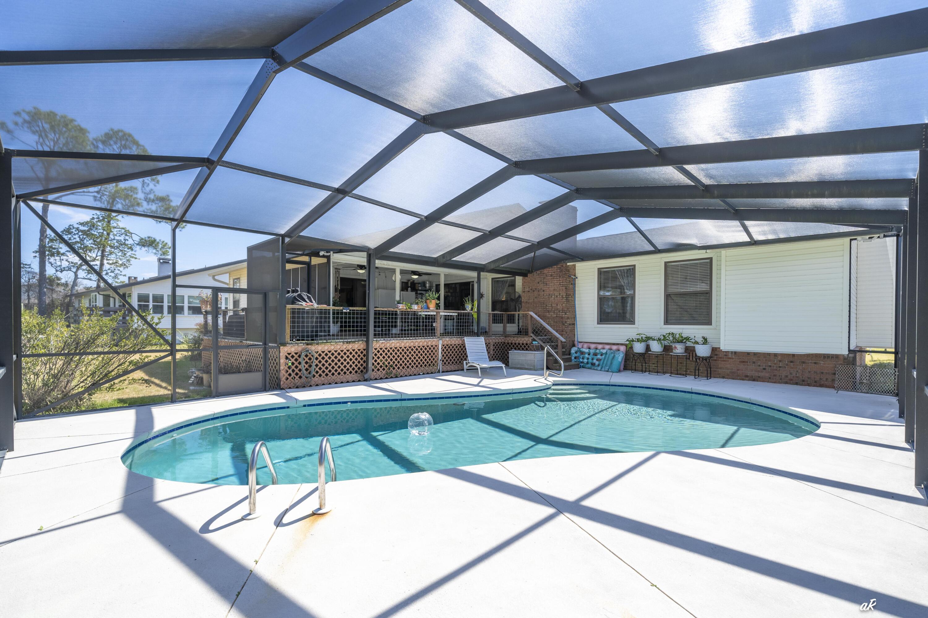 2910 Kings Harbour Road Panama City, FL 32405 - Photo 35 of 50 a view of a swimming pool with a patio