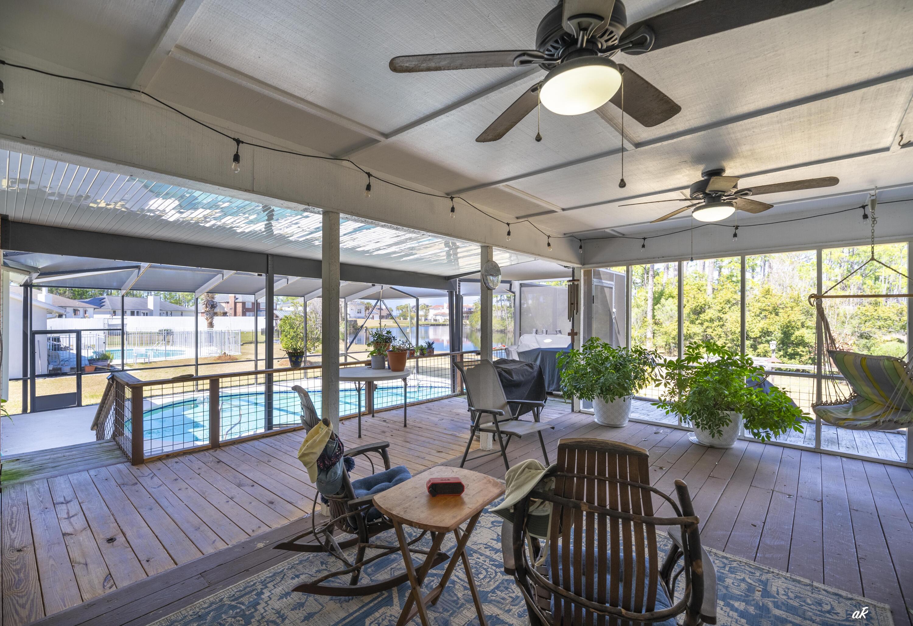 2910 Kings Harbour Road Panama City, FL 32405 - Photo 36 of 50 a view of a dining room with furniture window and wooden floor
