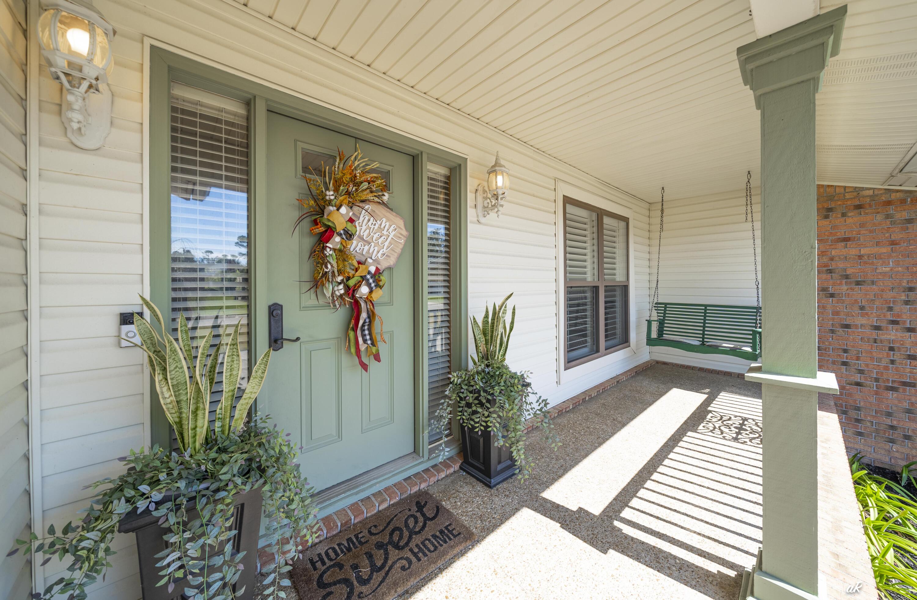 2910 Kings Harbour Road Panama City, FL 32405 - Photo 4 of 50 a view of a entryway door of the house