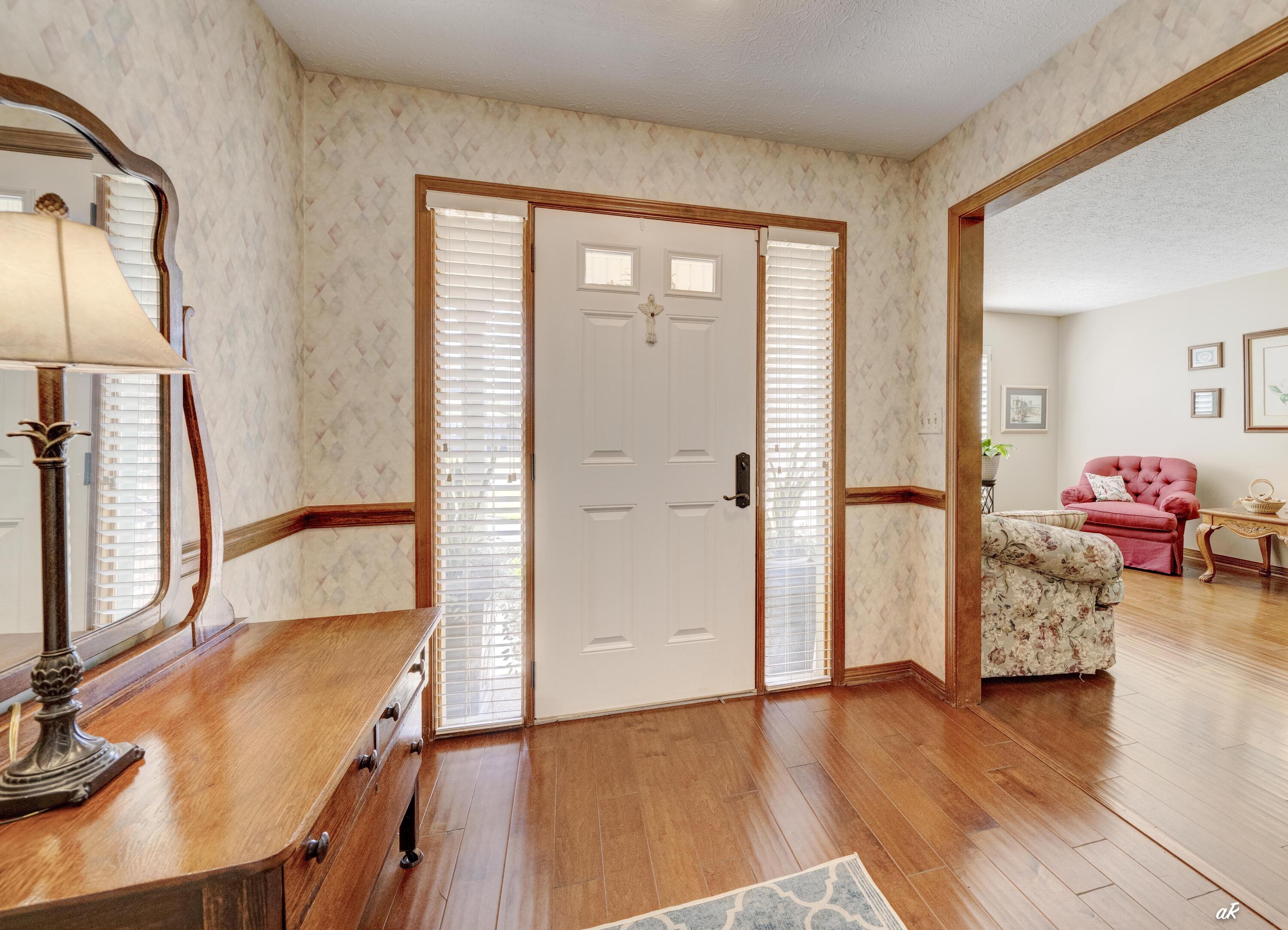 2910 Kings Harbour Road Panama City, FL 32405 - Photo 5 of 50 a view of a livingroom with furniture and wooden floor