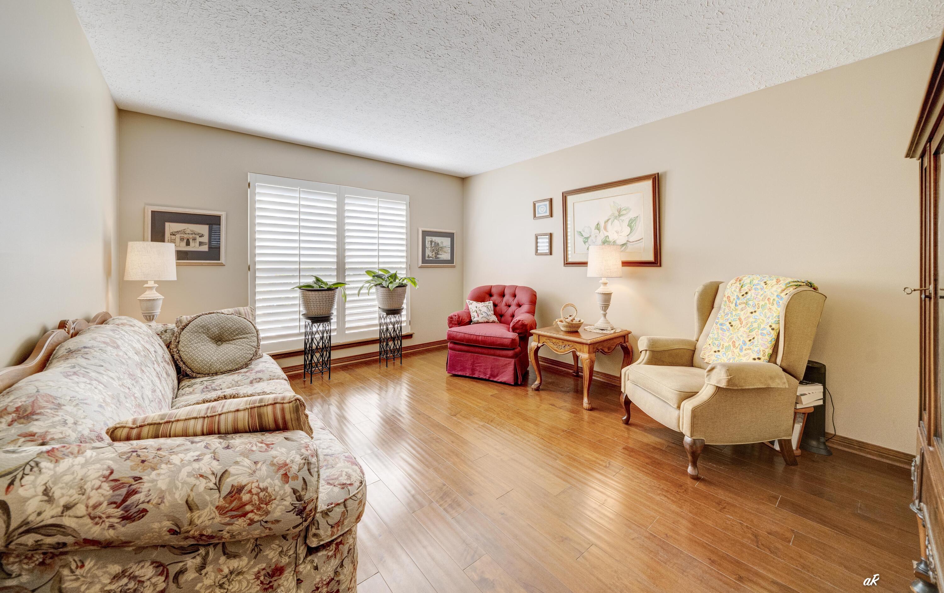 2910 Kings Harbour Road Panama City, FL 32405 - Photo 8 of 50 a living room with furniture and a wooden floor