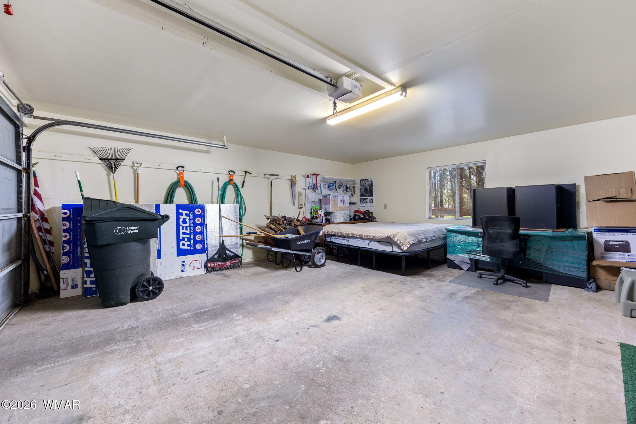 7456 Geronimo Road Pinetop, AZ 85935 - Photo 25 of 35 a view of a livingroom with furniture and a garage