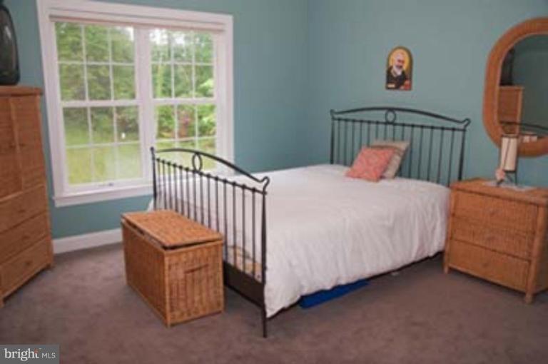 14616 Manor Road Phoenix, MD 21131 - Photo 18 of 30 a bedroom with a bed and a window