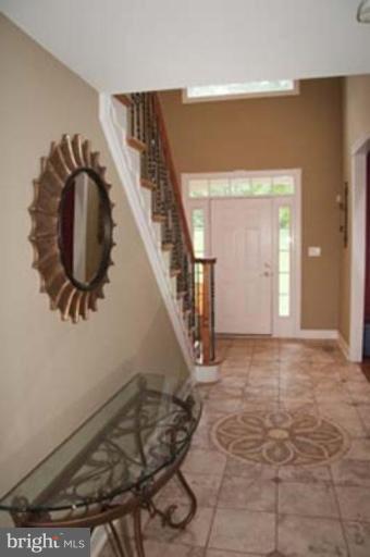 14616 Manor Road Phoenix, MD 21131 - Photo 3 of 30 a view of entryway and hall with wooden floor