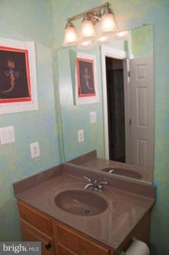 14616 Manor Road Phoenix, MD 21131 - Photo 21 of 30 a bathroom with a sink and a mirror