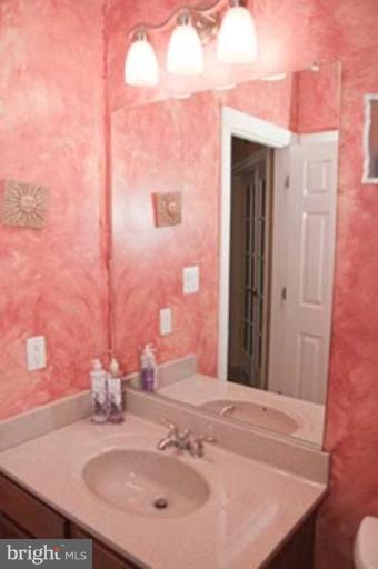 14616 Manor Road Phoenix, MD 21131 - Photo 22 of 30 a bathroom with a sink and a mirror