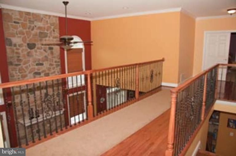 14616 Manor Road Phoenix, MD 21131 - Photo 24 of 30 a view of a balcony with wooden floor