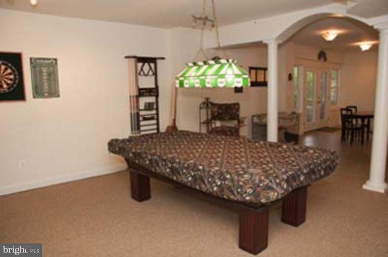 14616 Manor Road Phoenix, MD 21131 - Photo 26 of 30 a living room with furniture and a chandelier