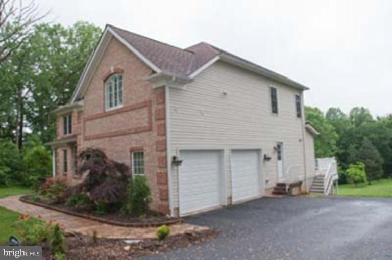 14616 Manor Road Phoenix, MD 21131 - Photo 29 of 30 a view of a house with a yard and garage