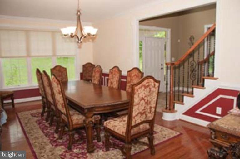 14616 Manor Road Phoenix, MD 21131 - Photo 6 of 30 a view of a dining room with furniture and chandelier