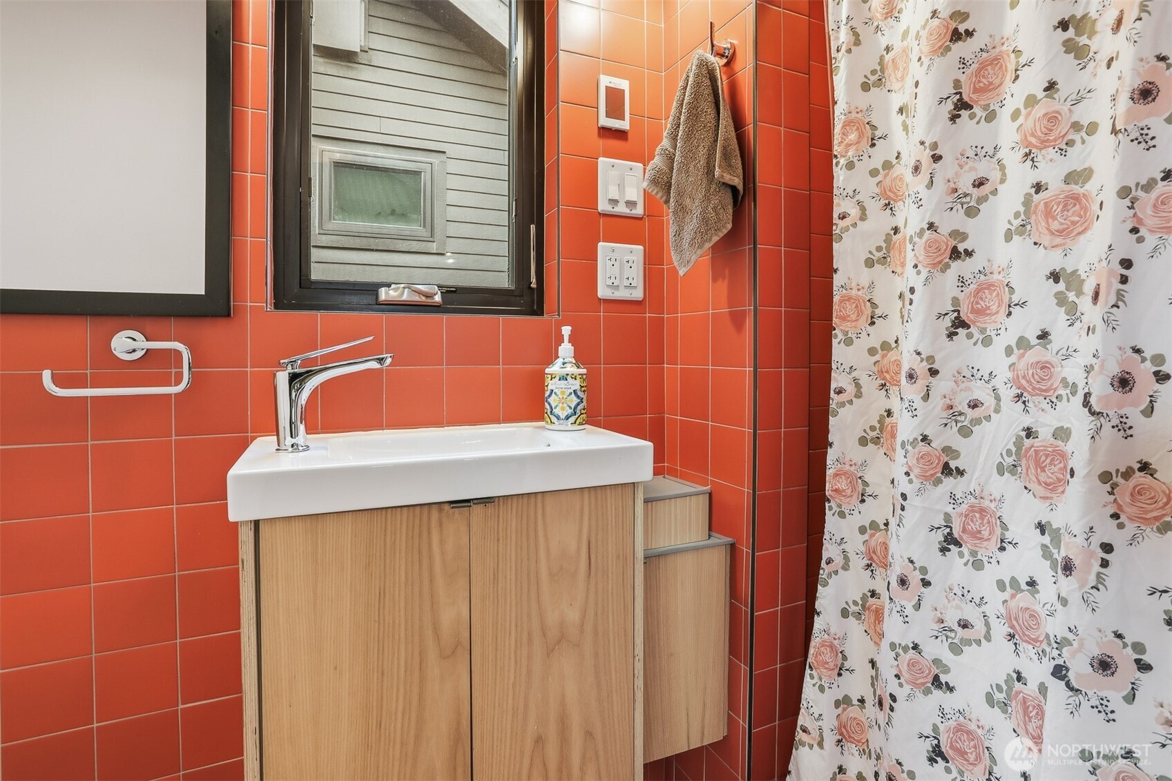 3868 16th Avenue Southwest Seattle, WA 98106 - Photo 4 of 37 a bathroom with a sink and a mirror