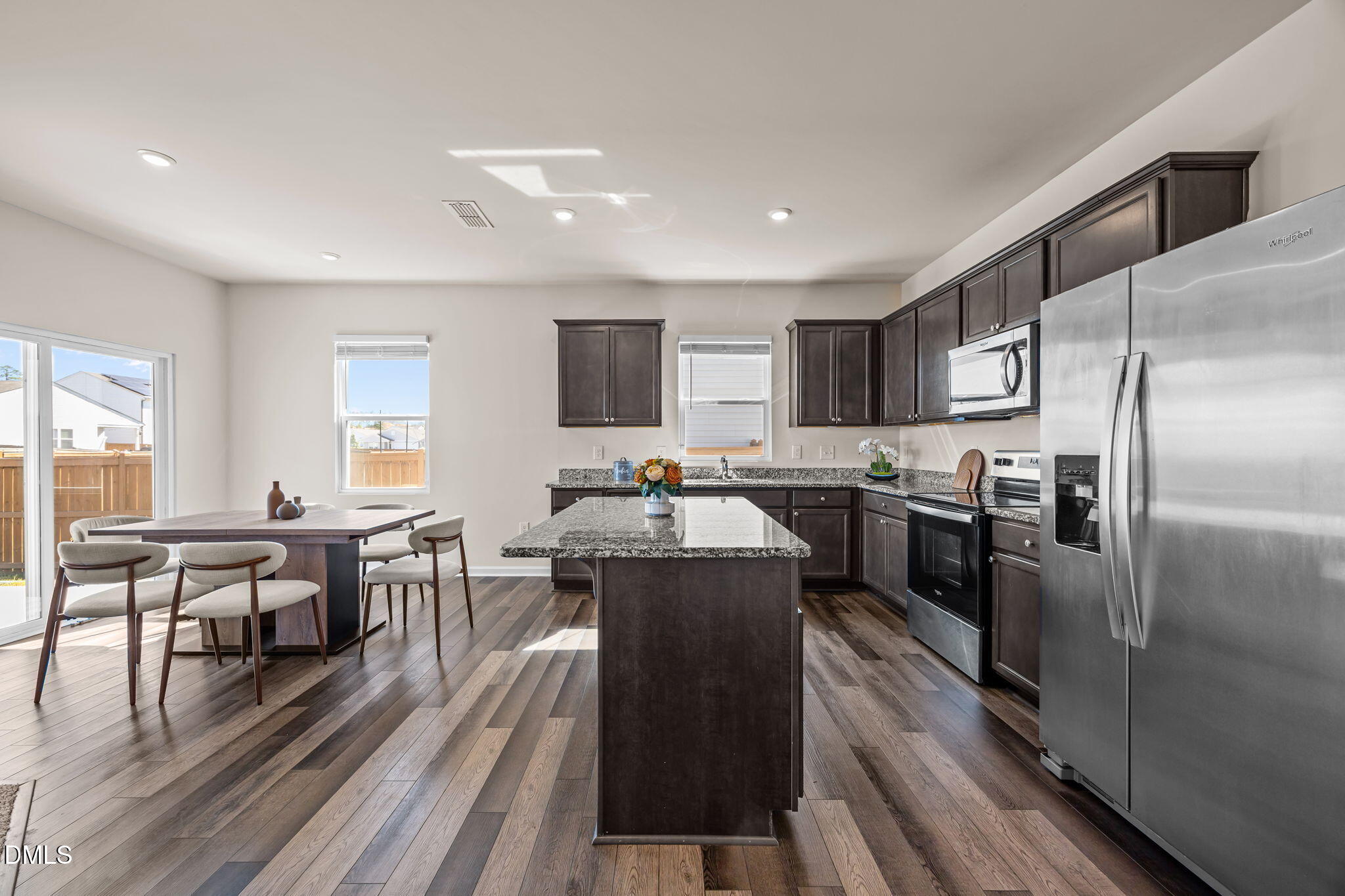 3525 Polygon Place Raleigh, NC 27604 - Photo 2 of 30 a kitchen with counter top space a sink appliances and cabinets
