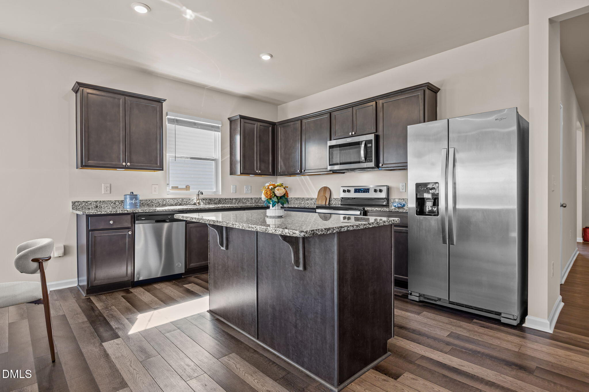 3525 Polygon Place Raleigh, NC 27604 - Photo 4 of 30 a kitchen with stainless steel appliances granite countertop a refrigerator a stove and a sink with wooden floor