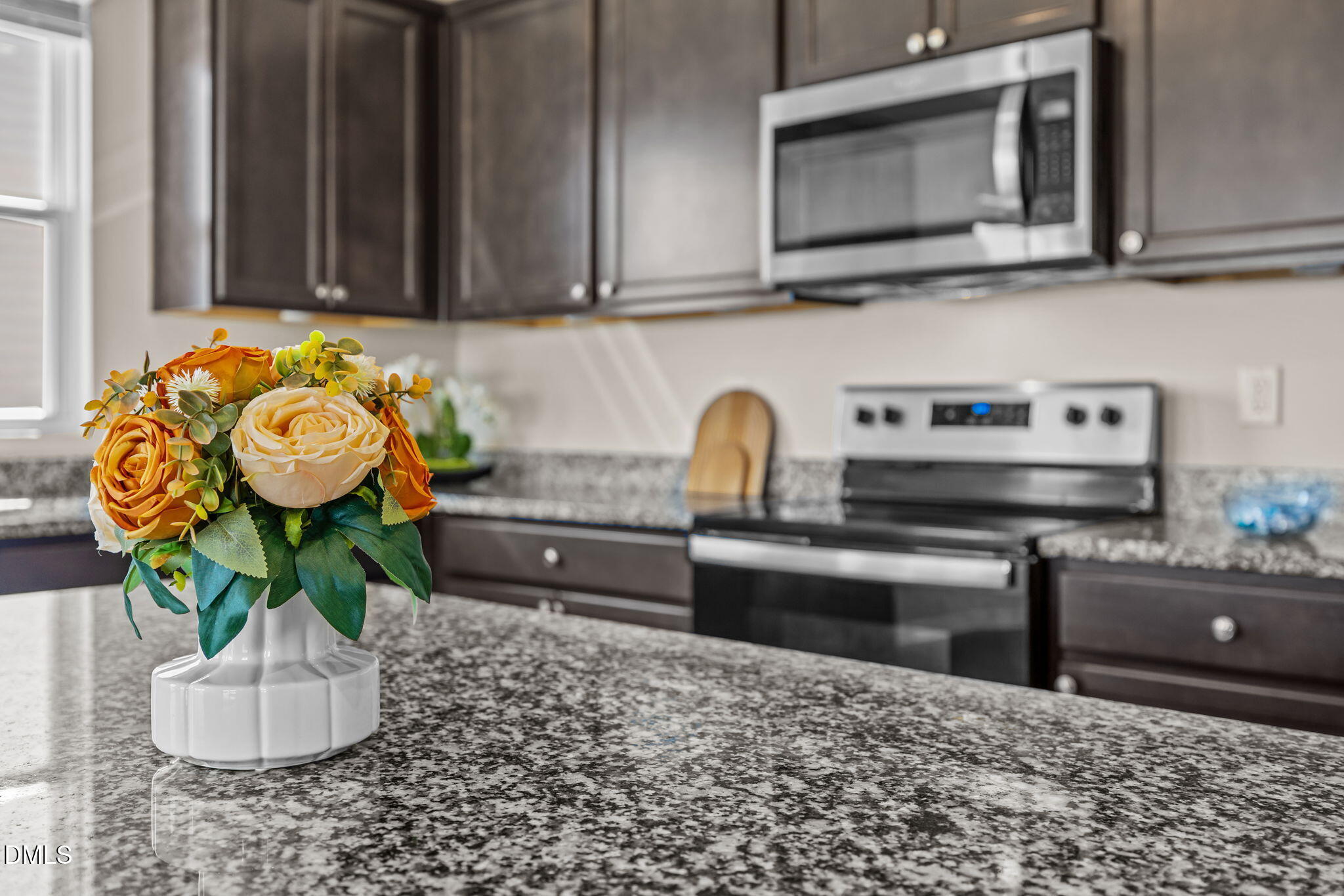 3525 Polygon Place Raleigh, NC 27604 - Photo 5 of 30 a kitchen with a stove and a microwave